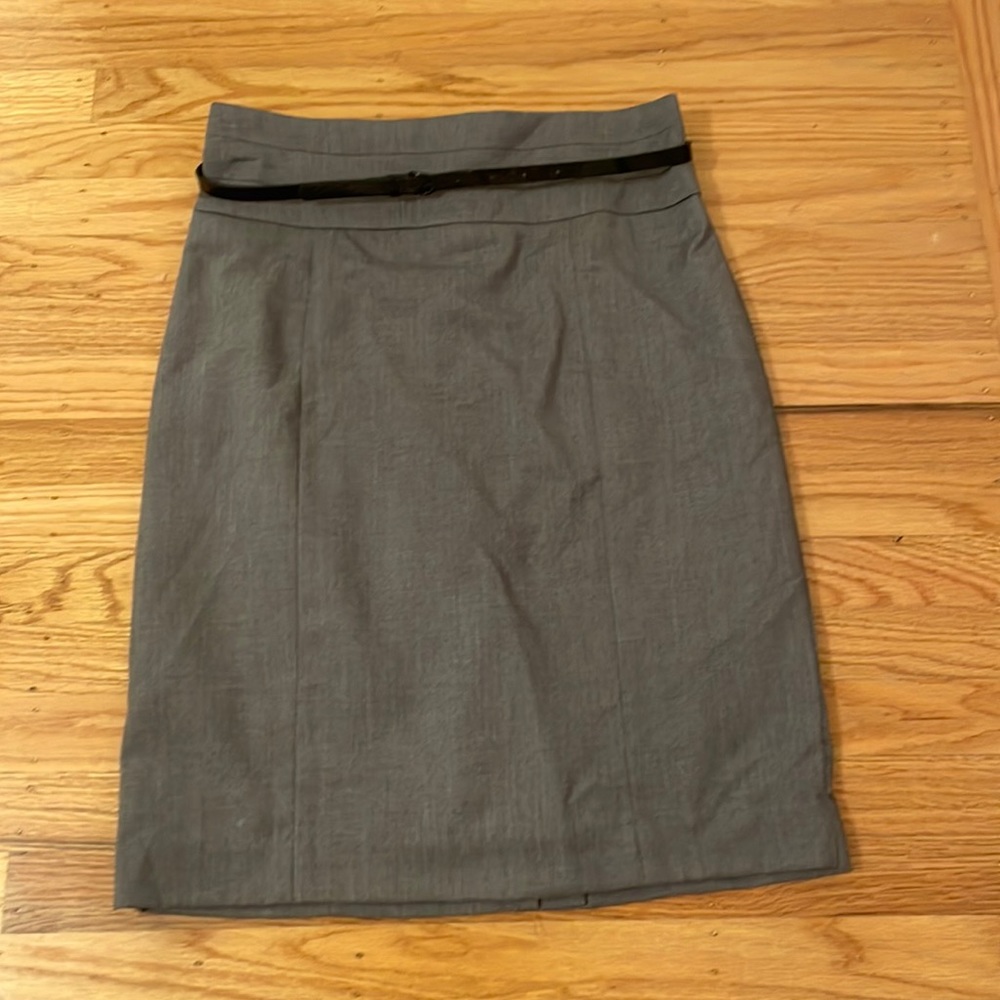 Gray knee length pencil skirt with patent leather belt
